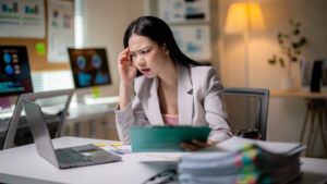 Business owner analyzing digital website equity versus Renting Your Website on a laptop screen